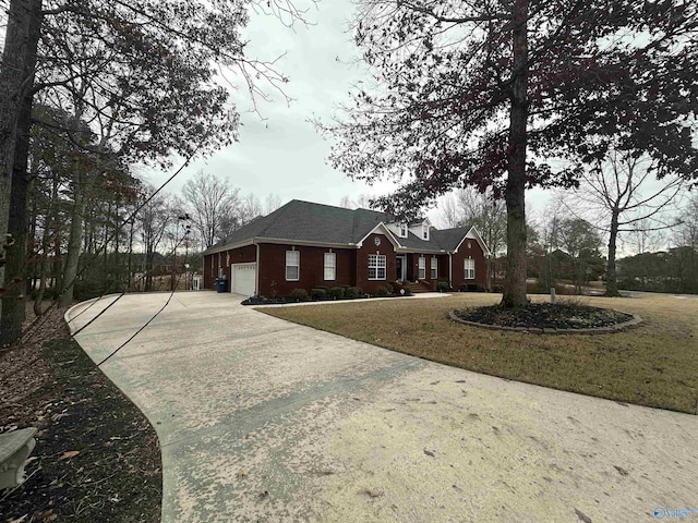 view of front of house with a front yard and a garage