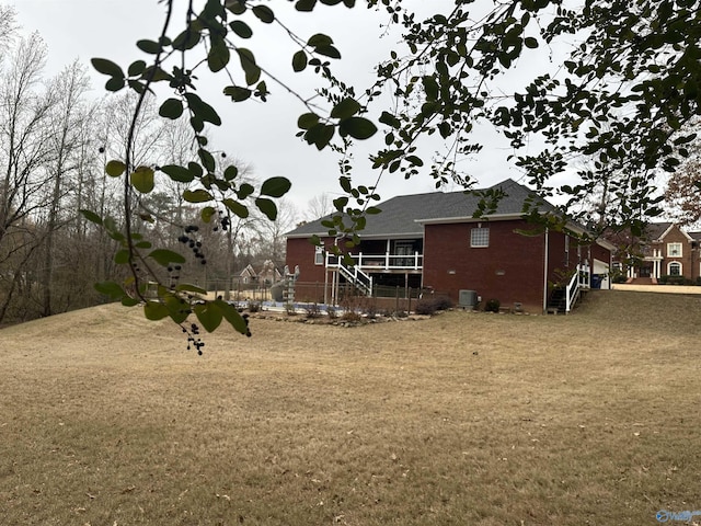 view of yard with central AC unit