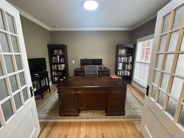 office featuring light hardwood / wood-style flooring and ornamental molding