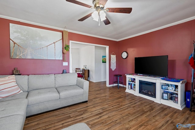 living room featuring ornamental molding, hardwood / wood-style floors, and ceiling fan