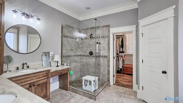 25 Cypress Grove Ln, Huntsville, AL 35824 - bathroom with vanity, a stall shower, crown molding, a walk in closet, and tile patterned floors