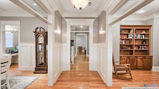 25 Cypress Grove Ln, Huntsville, AL 35824 - corridor featuring a decorative wall, light wood-style flooring, crown molding, and wainscoting