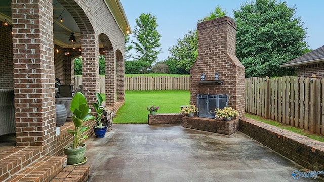 25 Cypress Grove Ln, Huntsville, AL 35824 - view of patio with an outdoor brick fireplace and a ceiling fan