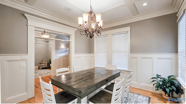 25 Cypress Grove Ln, Huntsville, AL 35824 - dining room with a chandelier, a decorative wall, ornamental molding, wainscoting, and light wood finished floors