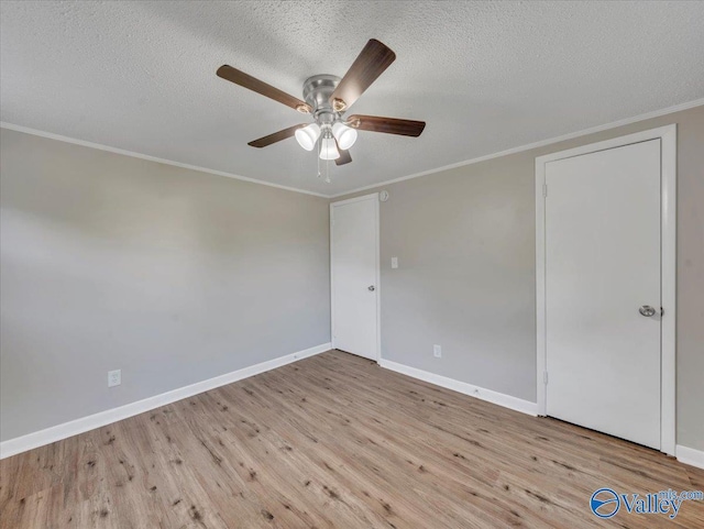 768 County Road 376, Hillsboro, AL 35643 - empty room with wood finished floors, a ceiling fan, baseboards, crown molding, and a textured ceiling