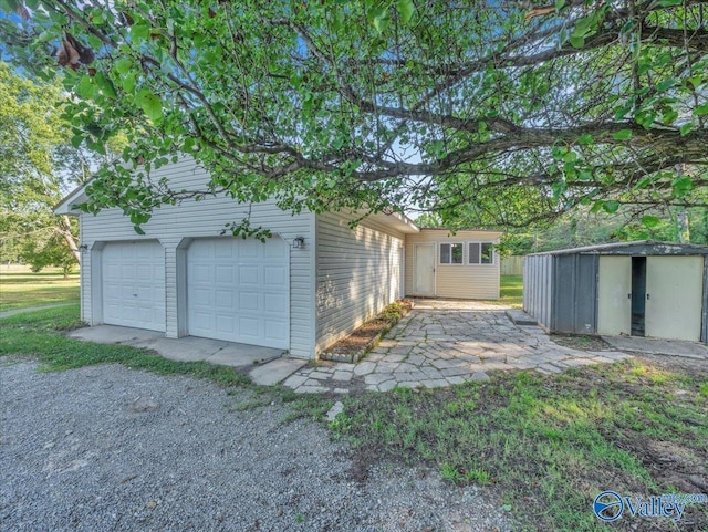 768 County Road 376, Hillsboro, AL 35643 - detached garage featuring a storage unit