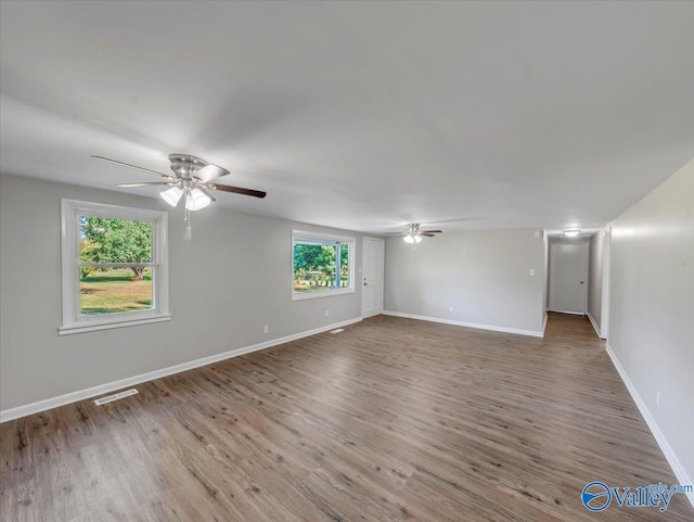 768 County Road 376, Hillsboro, AL 35643 - spare room featuring ceiling fan, wood finished floors, and baseboards