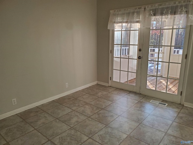 view of tiled spare room