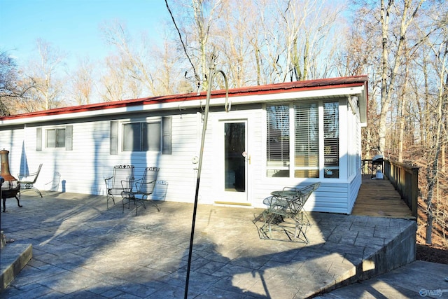 back of house with a patio