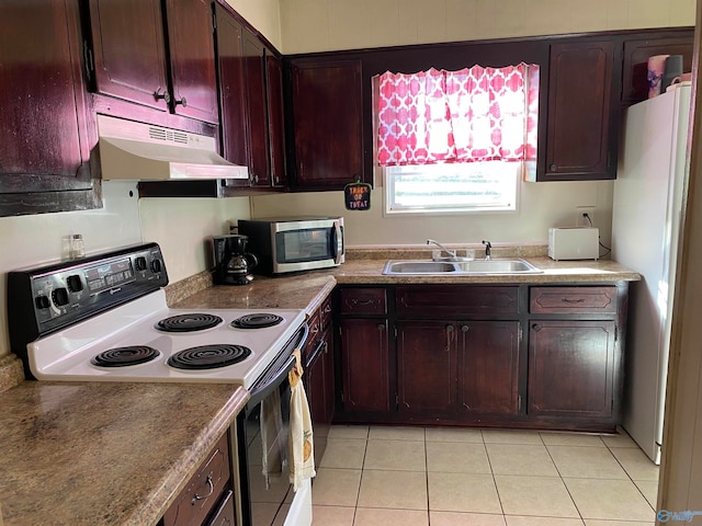 kitchen with sink, light tile patterned floors, and white appliances
