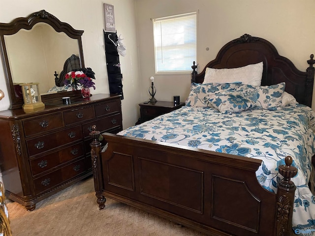 bedroom featuring light carpet