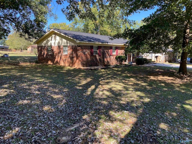 view of property exterior with a yard
