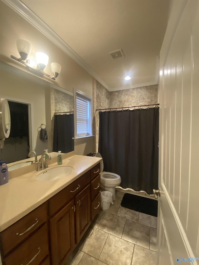 bathroom featuring crown molding, vanity, and toilet