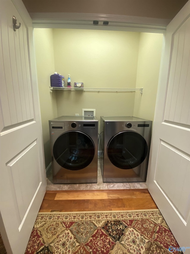 washroom with separate washer and dryer