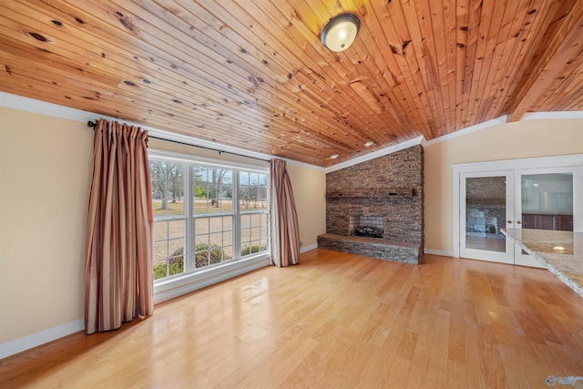 unfurnished living room featuring a stone fireplace, vaulted ceiling, wooden ceiling, light wood-type flooring, and ornamental molding