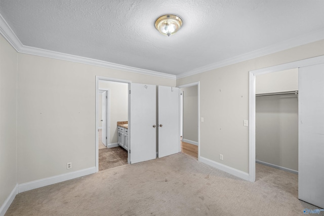 unfurnished bedroom with crown molding, light colored carpet, and a closet