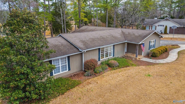 single story home featuring a front yard