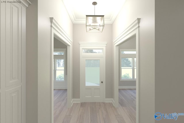 entryway featuring ornamental molding, light hardwood / wood-style flooring, and a notable chandelier