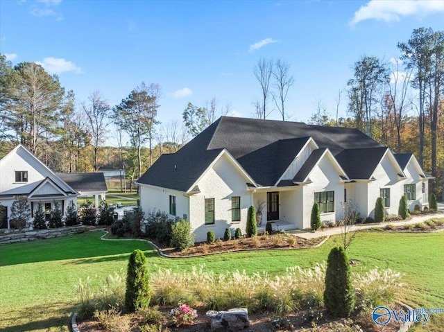 modern inspired farmhouse with a front yard