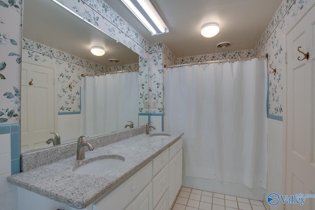 bathroom with vanity, tile patterned floors, and shower / tub combo with curtain