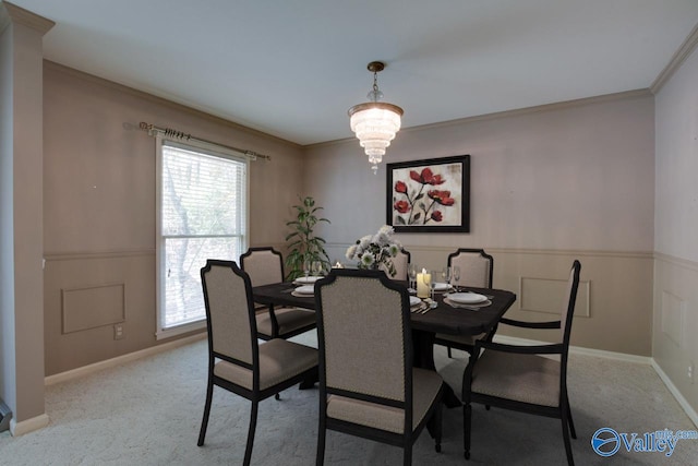 dining space featuring a notable chandelier, crown molding, and light carpet