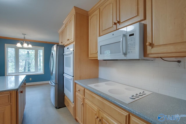 kitchen featuring white appliances, decorative light fixtures, decorative backsplash, ornamental molding, and a notable chandelier