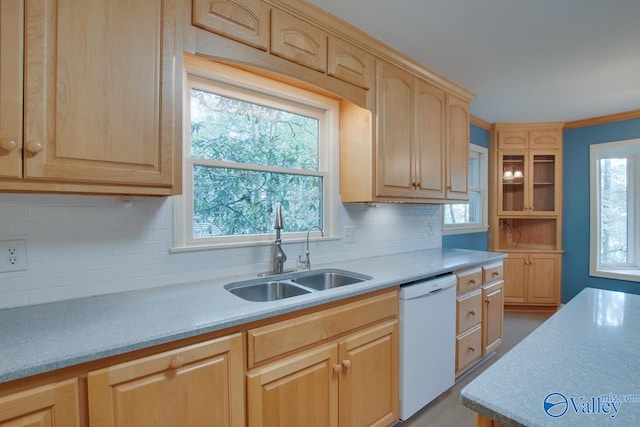 kitchen featuring decorative backsplash, light brown cabinets, white dishwasher, and sink