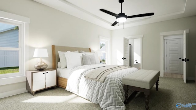 bedroom with a raised ceiling, baseboards, light carpet, and multiple windows