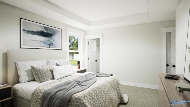 bedroom featuring carpet floors, baseboards, and a tray ceiling
