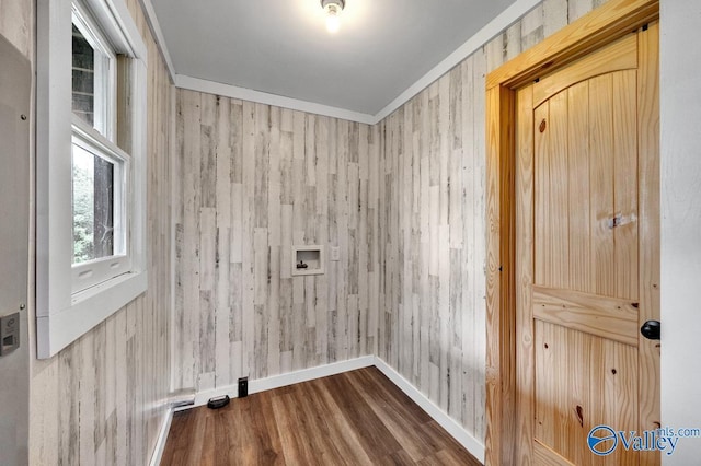 laundry room featuring hardwood / wood-style flooring, ornamental molding, and hookup for a washing machine