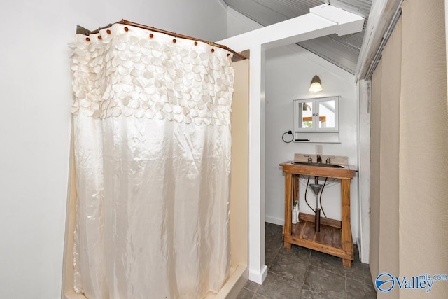 bathroom with a shower with curtain and sink