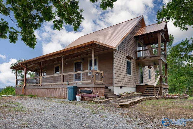 view of front of property with a porch and a balcony