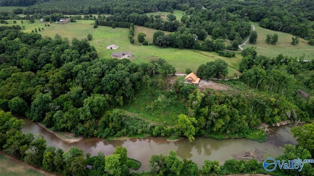 birds eye view of property featuring a water view and a rural view