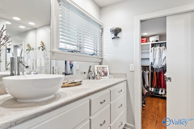 bathroom featuring vanity and wood-type flooring