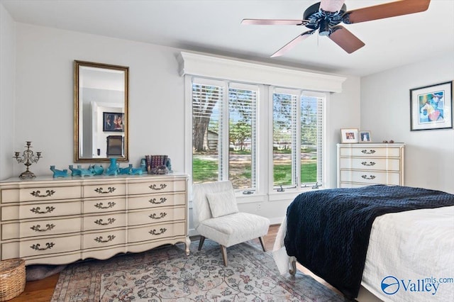 bedroom with ceiling fan and light hardwood / wood-style flooring