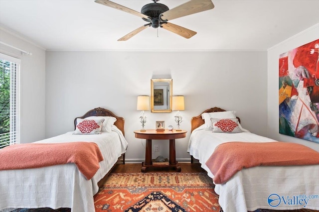 bedroom with crown molding, ceiling fan, and dark hardwood / wood-style flooring