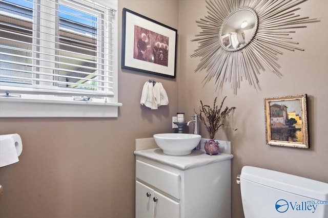 bathroom with vanity and toilet