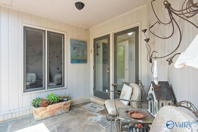 doorway to property with a patio