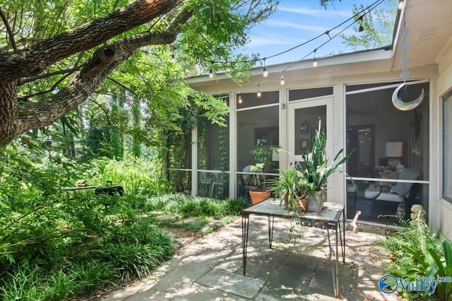 view of patio / terrace with a sunroom