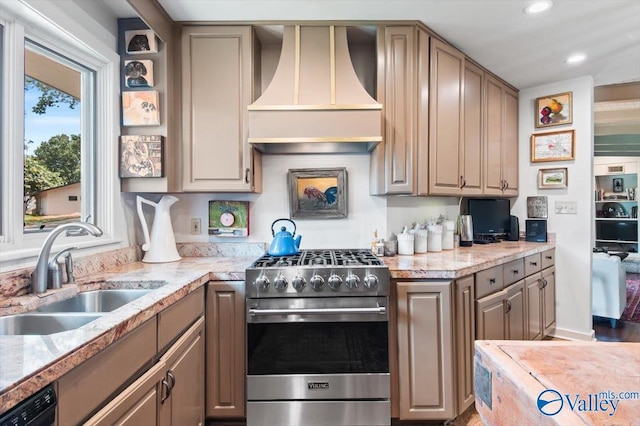 kitchen featuring sink, stainless steel stove, black dishwasher, light stone counters, and custom range hood