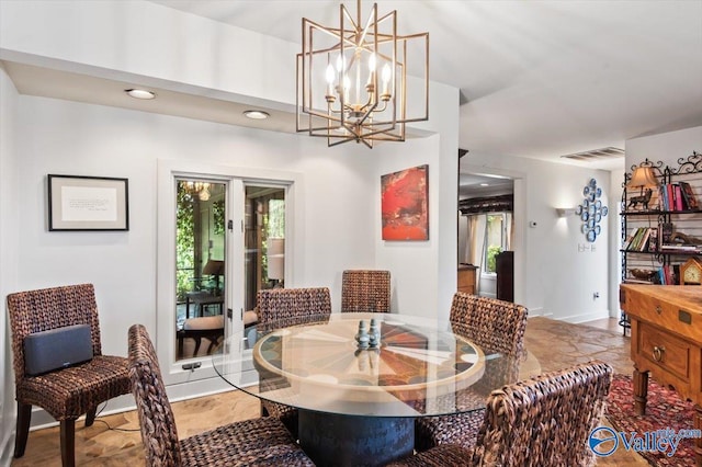 dining space featuring an inviting chandelier