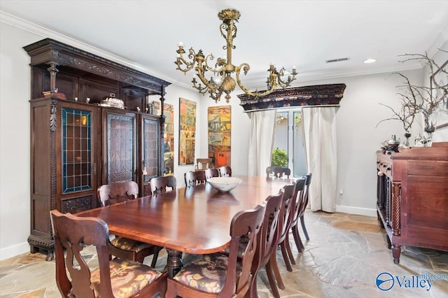 dining room featuring crown molding and an inviting chandelier