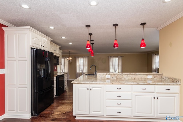 kitchen featuring white cabinetry, black appliances, dark hardwood / wood-style flooring, and ornamental molding