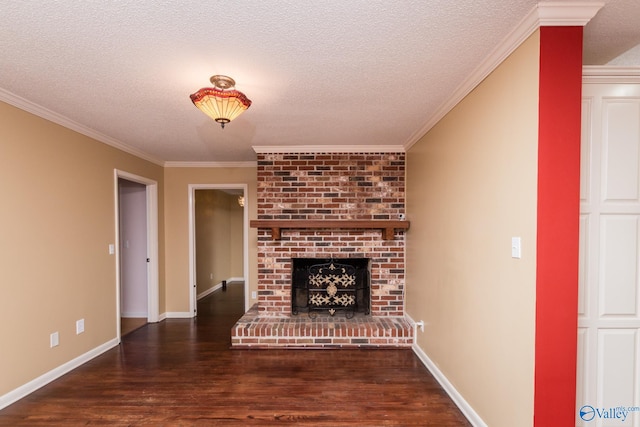 unfurnished living room with a brick fireplace, dark hardwood / wood-style floors, a textured ceiling, and crown molding