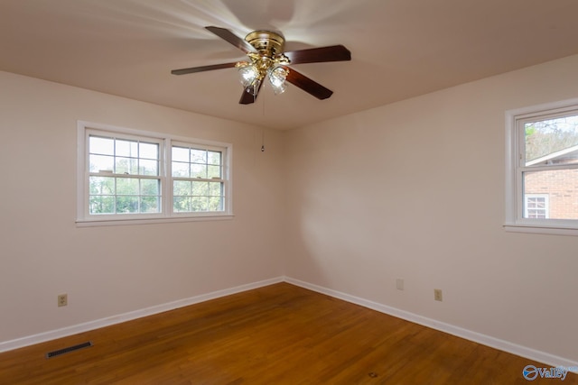 empty room with wood-type flooring and ceiling fan