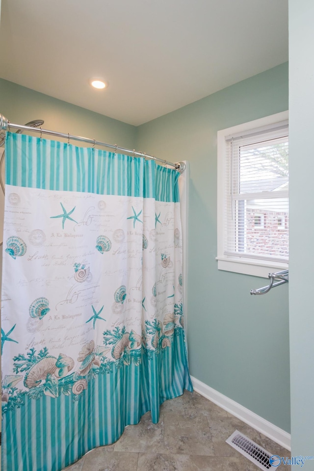 bathroom with a shower with curtain