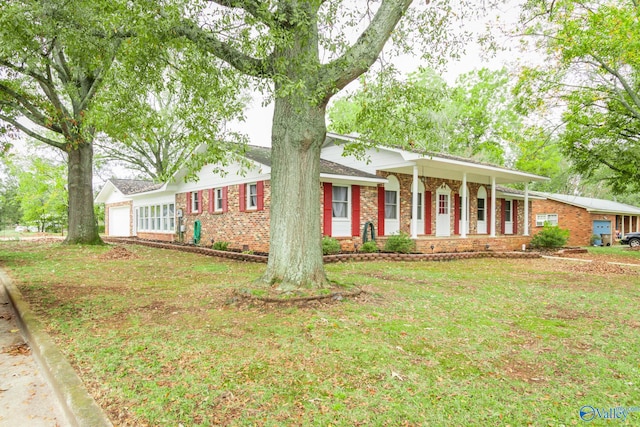 single story home featuring a porch and a front lawn