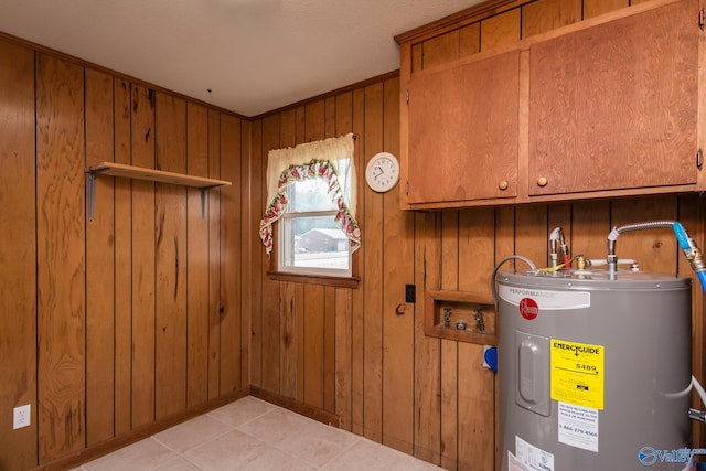 utility room with electric water heater