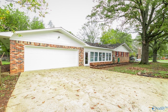 single story home with a garage