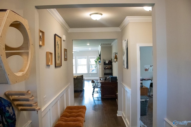 hallway with dark hardwood / wood-style flooring and crown molding